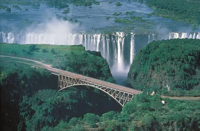 Aerial view of Victoria Falls with Victoria Falls Bridge spanning the gorge